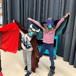 Three TDVA drama students dressed as dragons.